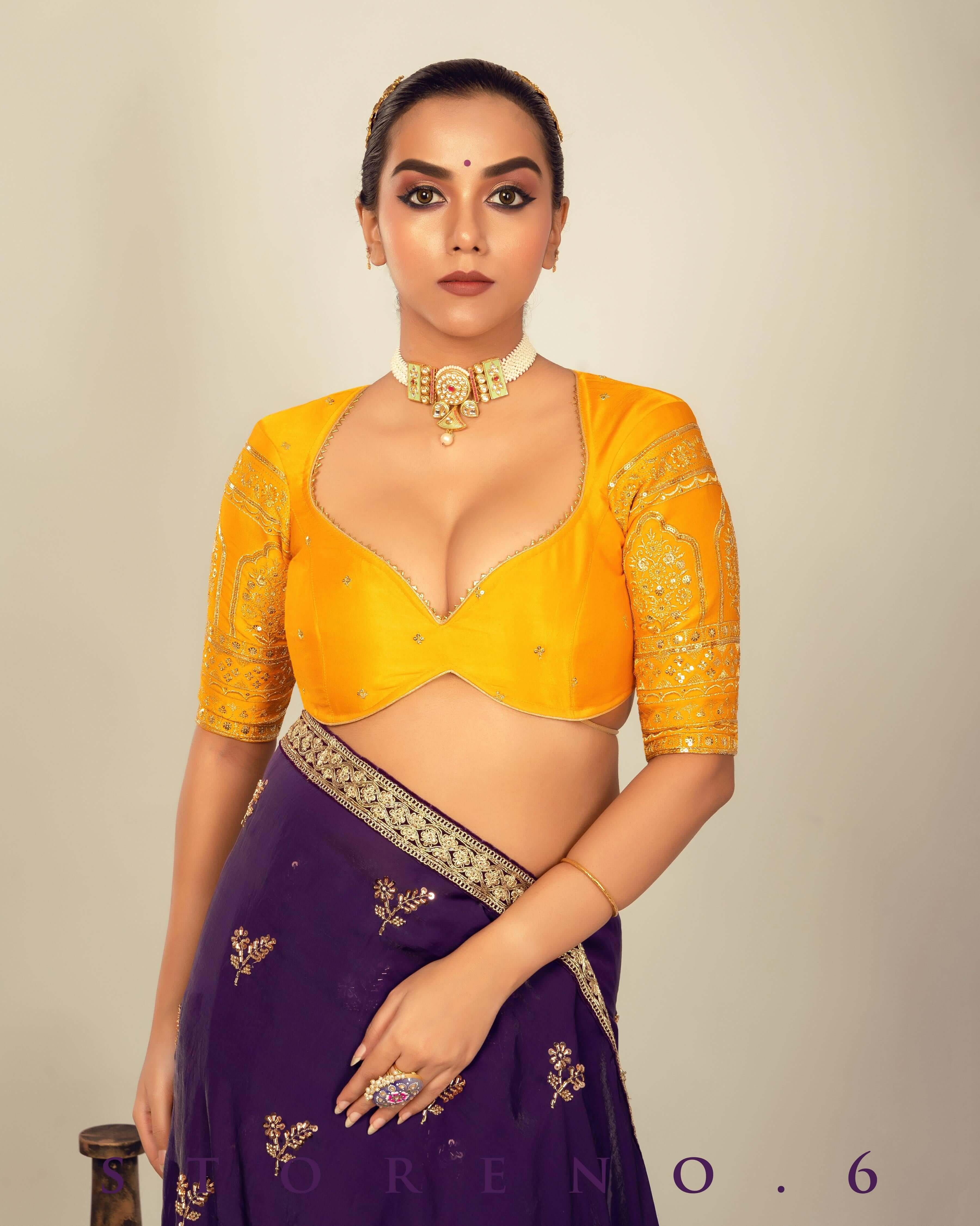 RAISIN REGALIA SAREE WITH TIMELESS TOPAZ BLOUSE.