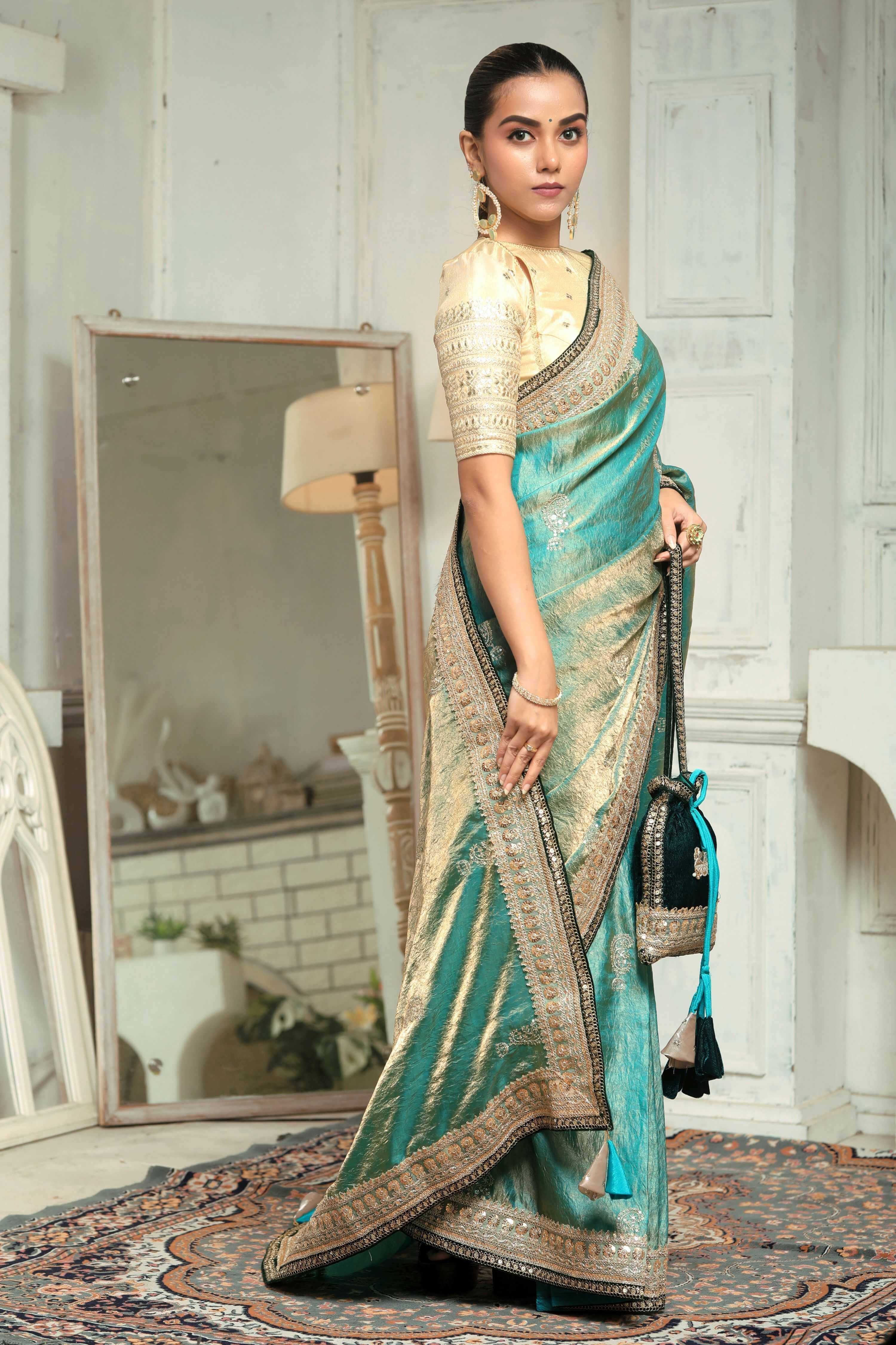 AQUA AMOUR SAREE WITH THE CLASSIC CHAMPAGNE BLOUSE