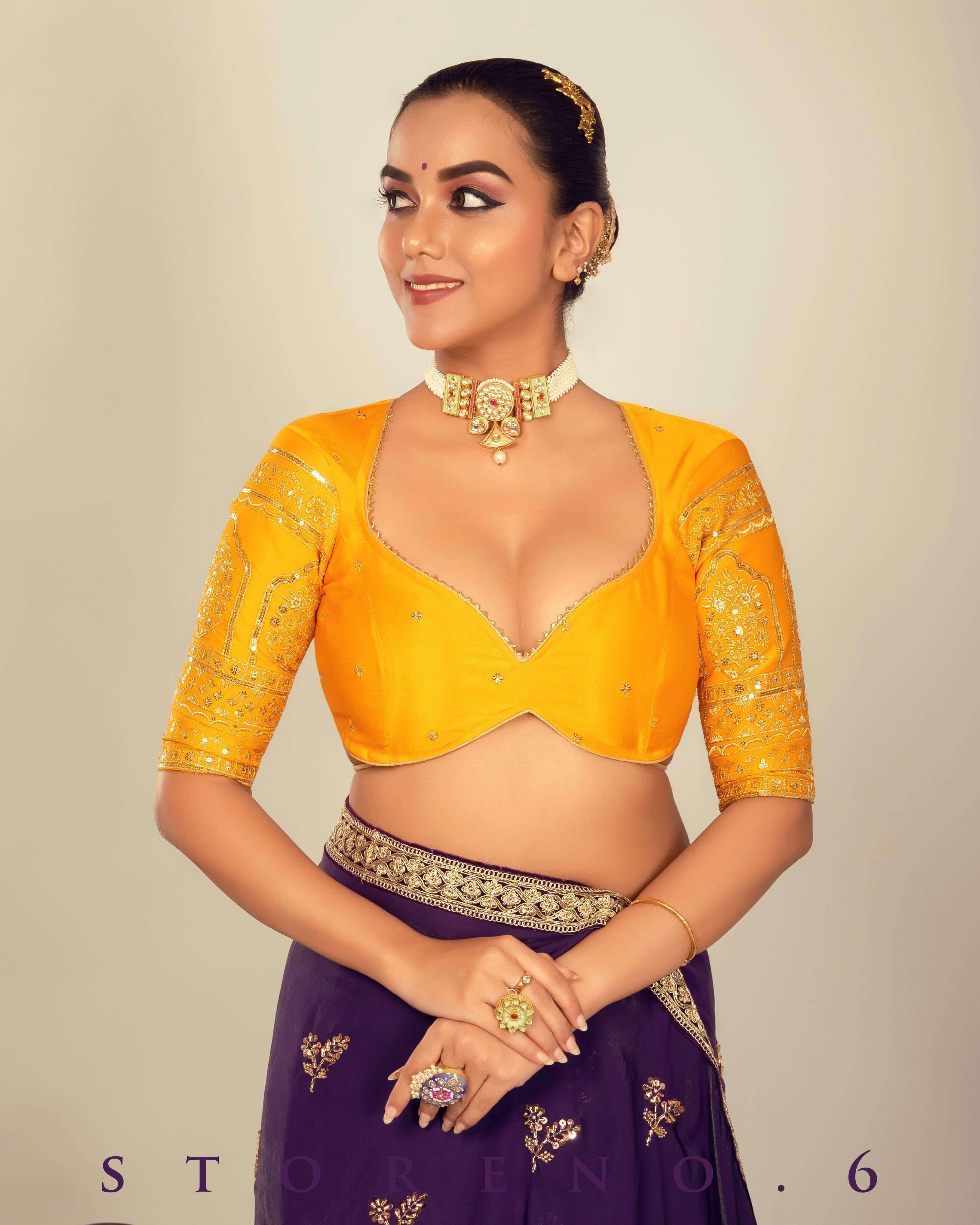 RAISIN REGALIA SAREE WITH TIMELESS TOPAZ BLOUSE.