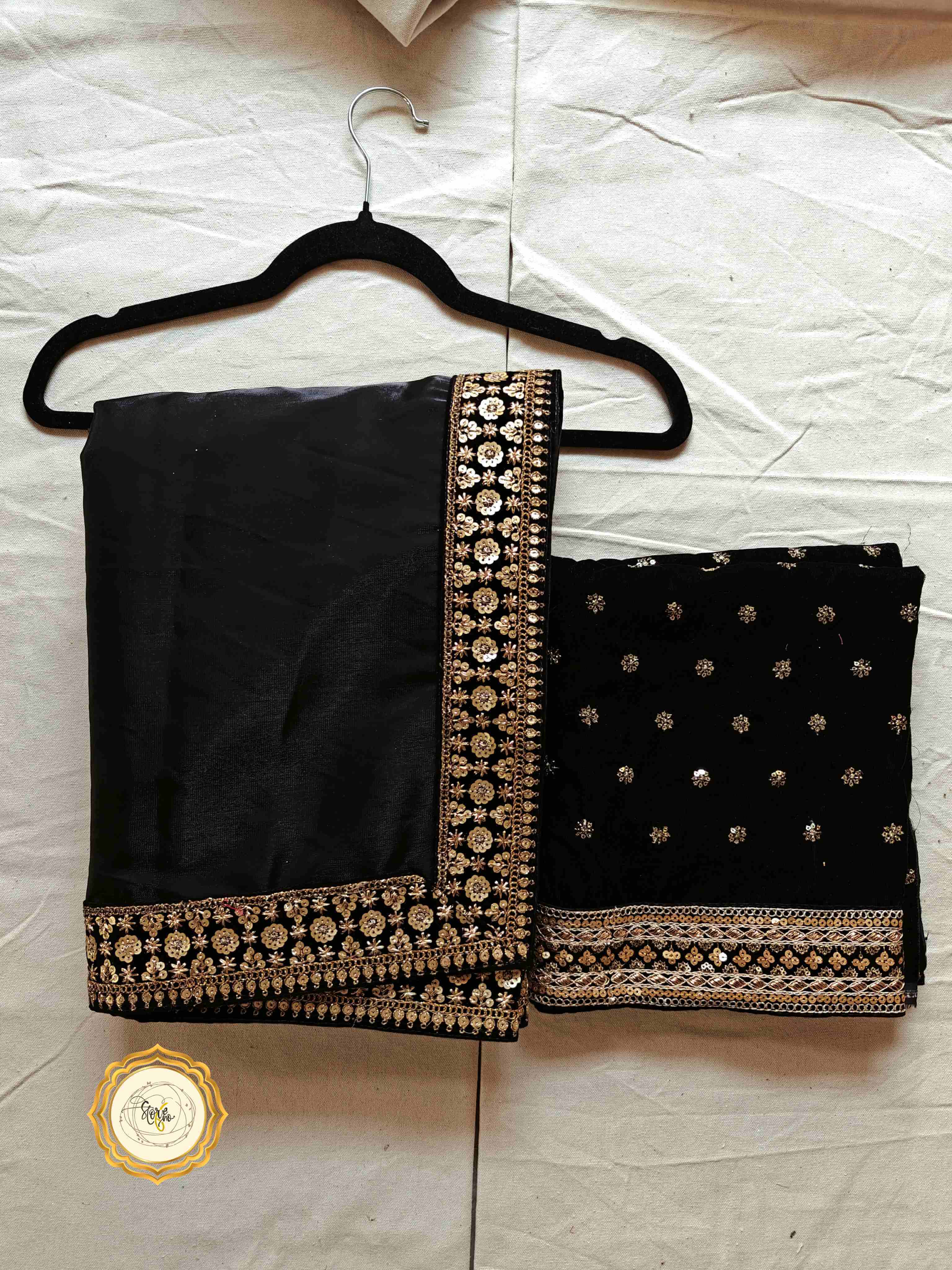 Classic black partywear saree with stunning lace work and embellished blouse fabric.