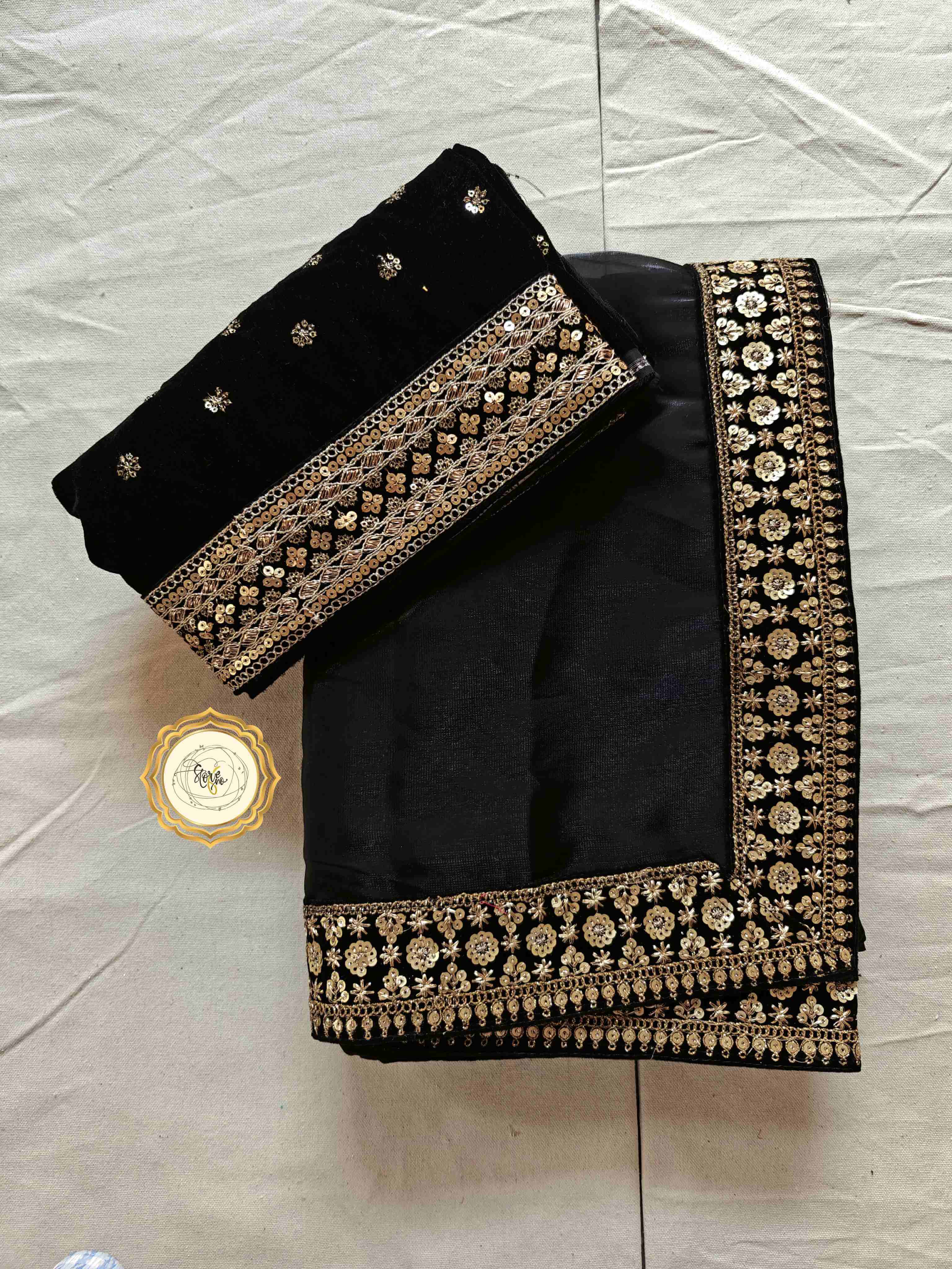 Classic black partywear saree with stunning lace and embroidered velvet blouse piece.