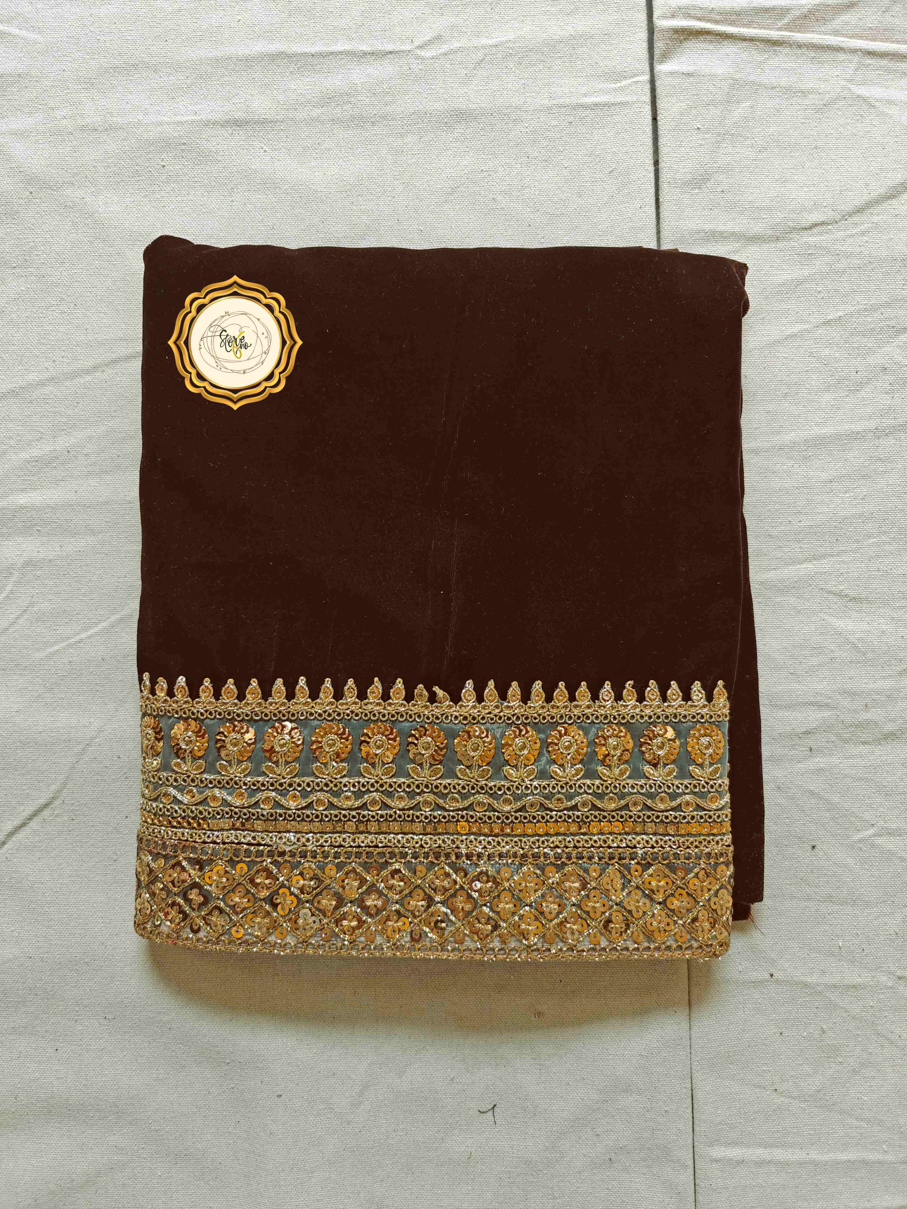Chocolate velvet fabric with golden embroidered borders, ideal for a pre draped satin saree with unstitched blouse.
