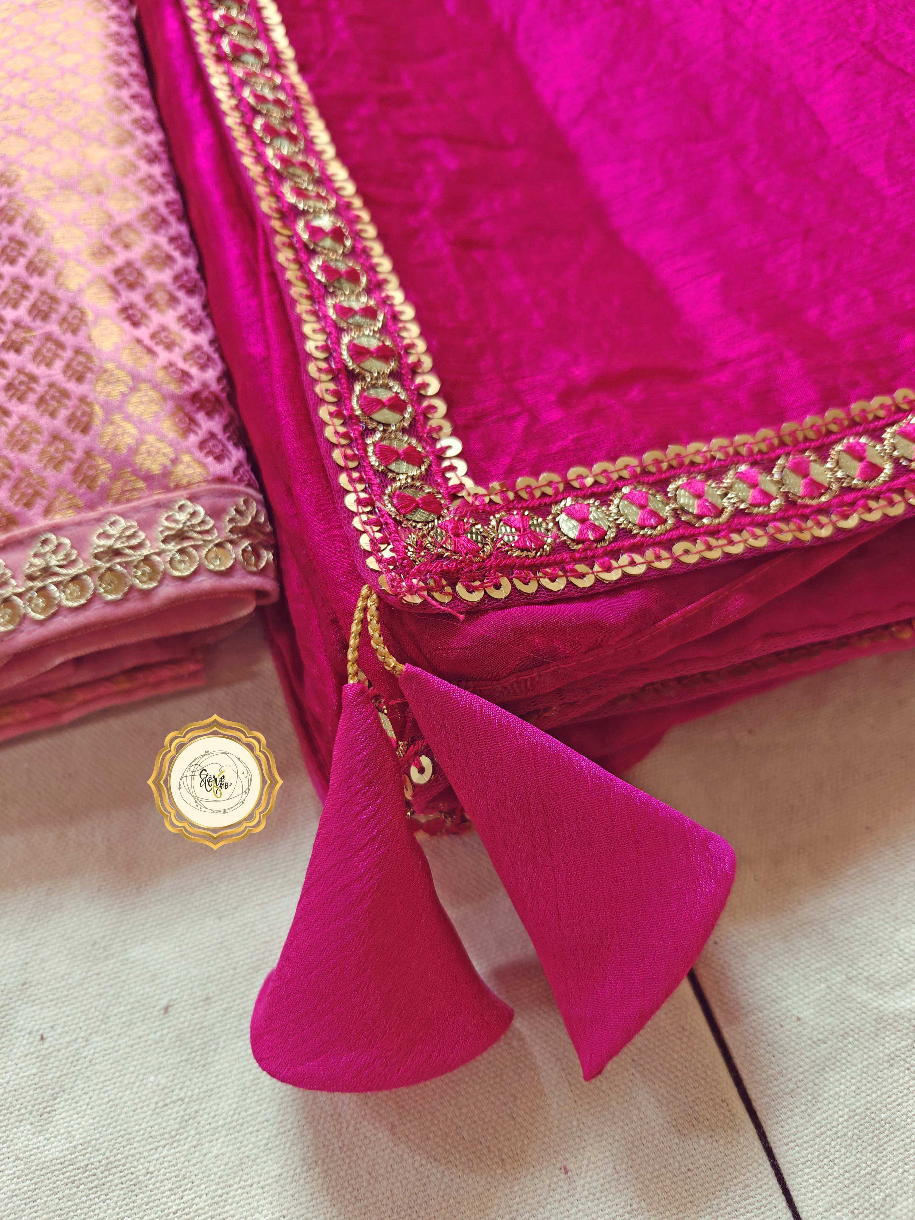 premium pink saree with unstitched blouse featuring cute tassels and stunning lace work.