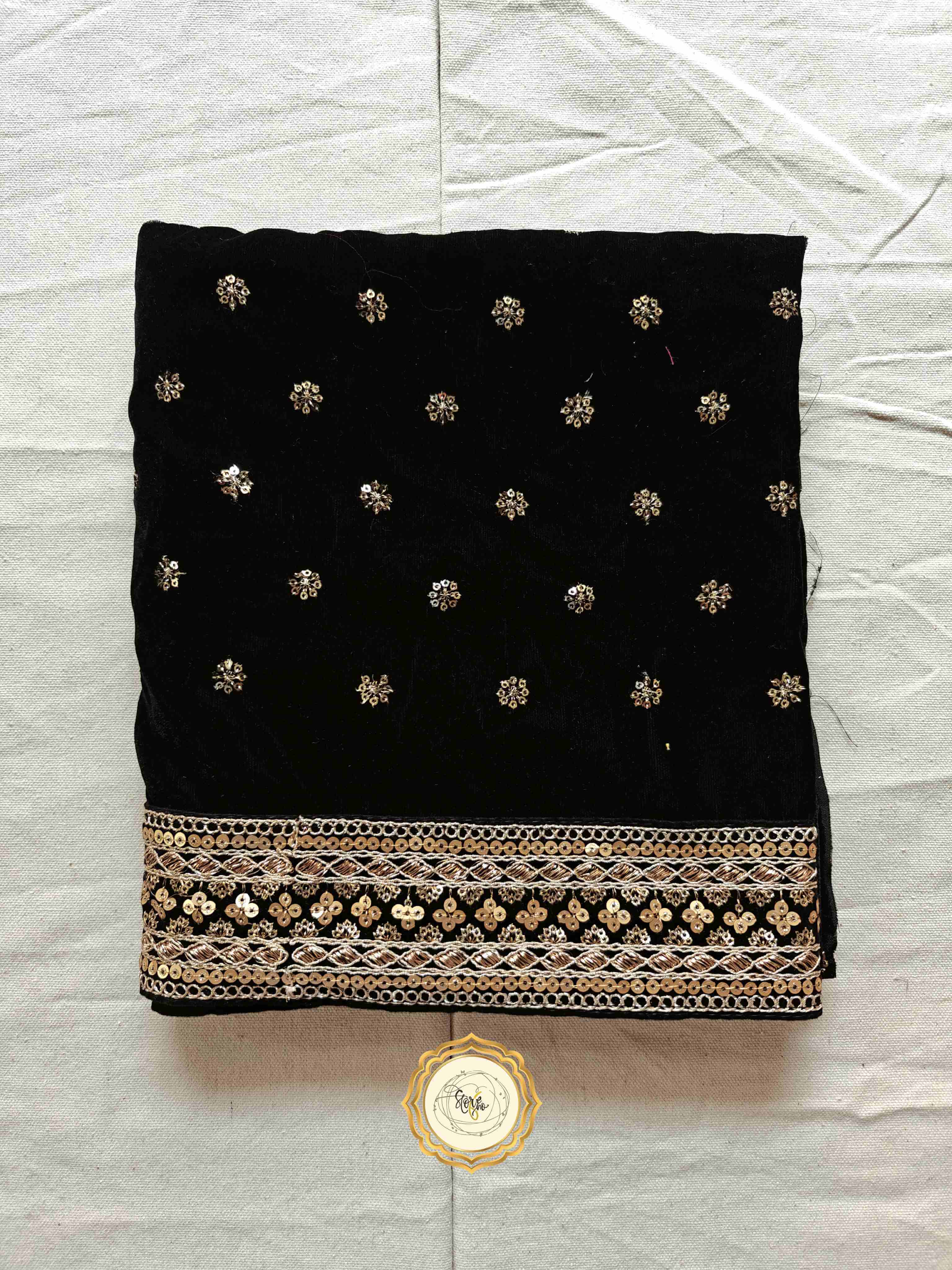 Black partywear saree blouse piece with zari and sequins embroidery, featuring a stunning embroidered border.