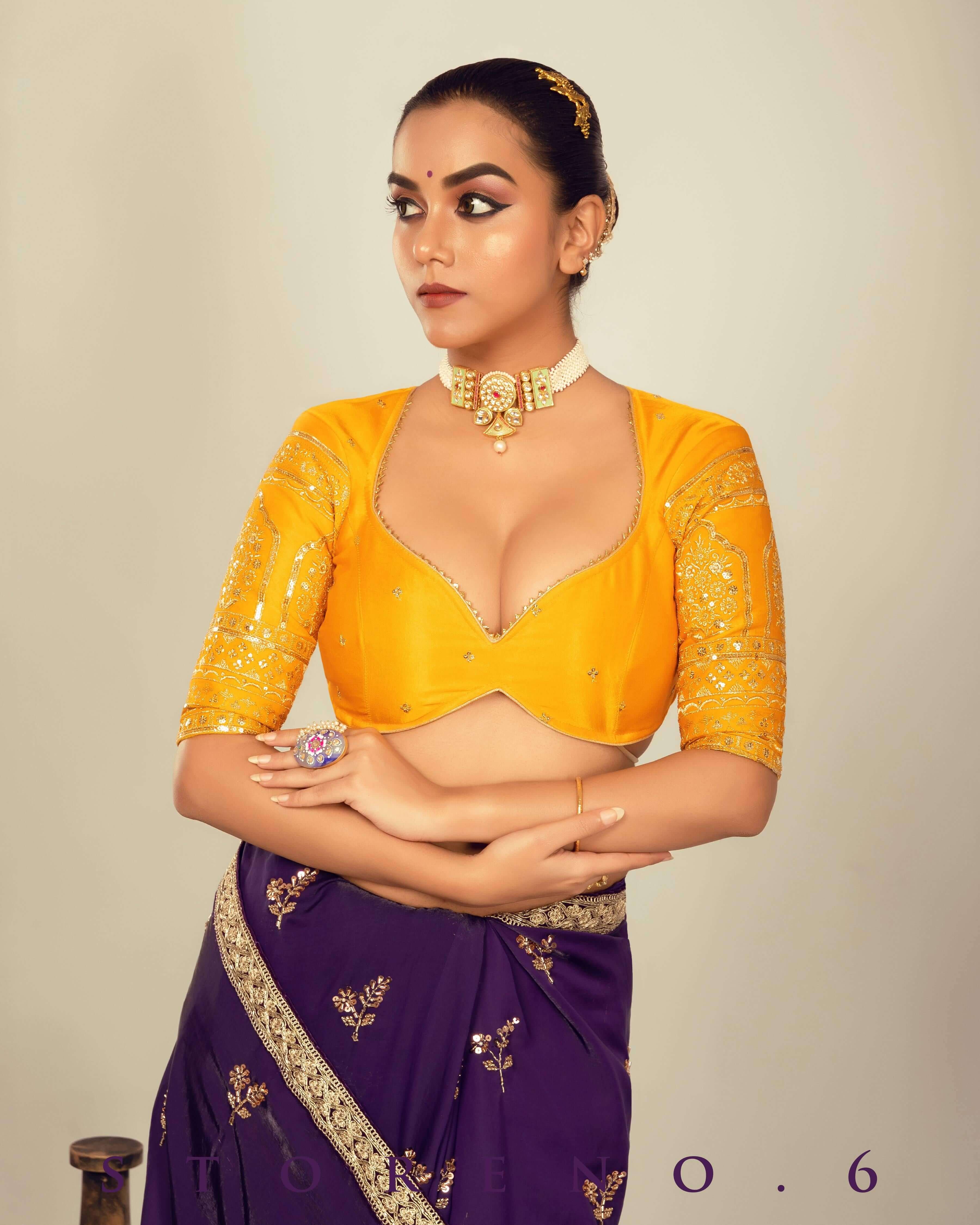 RAISIN REGALIA SAREE WITH TIMELESS TOPAZ BLOUSE.