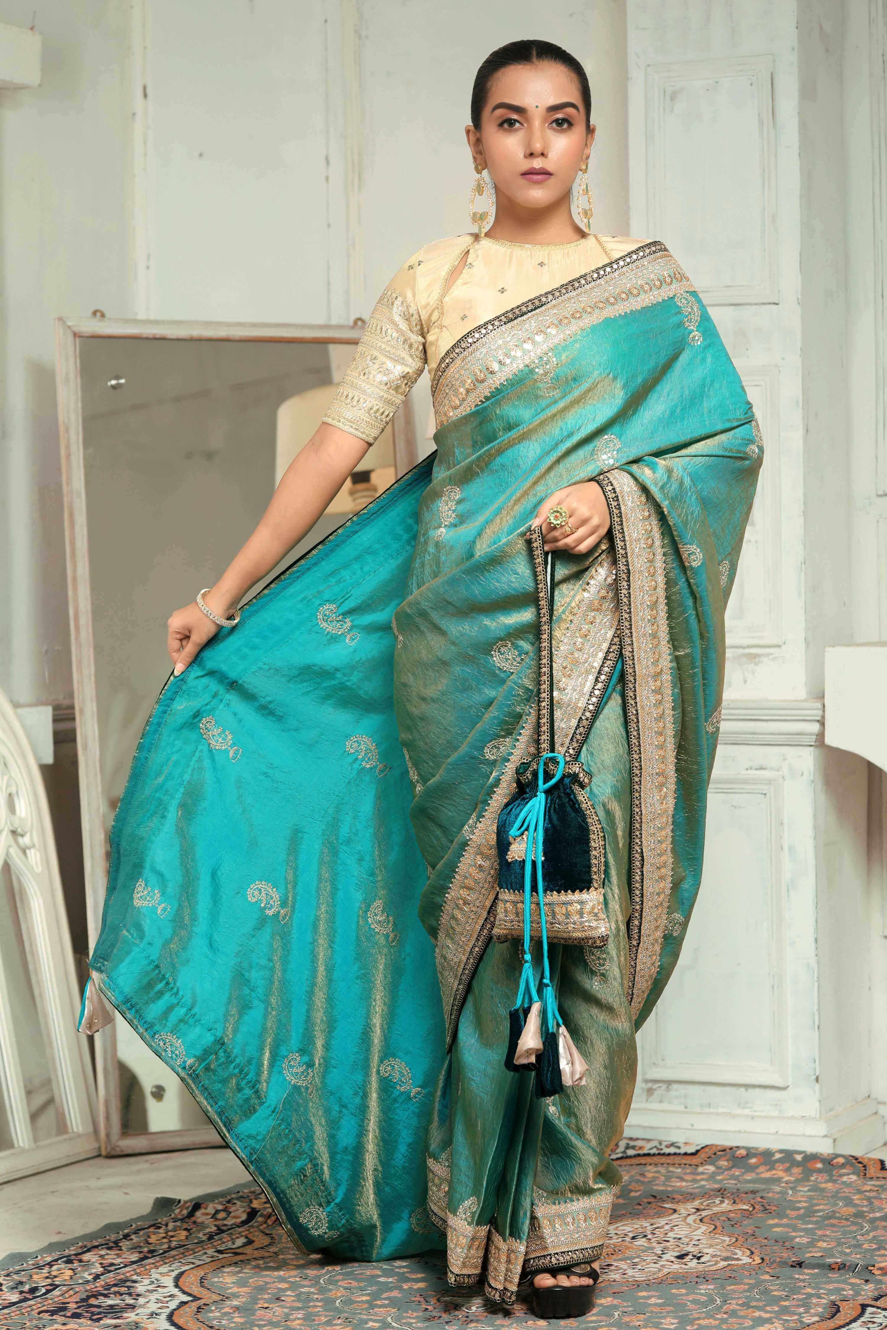 AQUA AMOUR SAREE WITH THE CLASSIC CHAMPAGNE BLOUSE